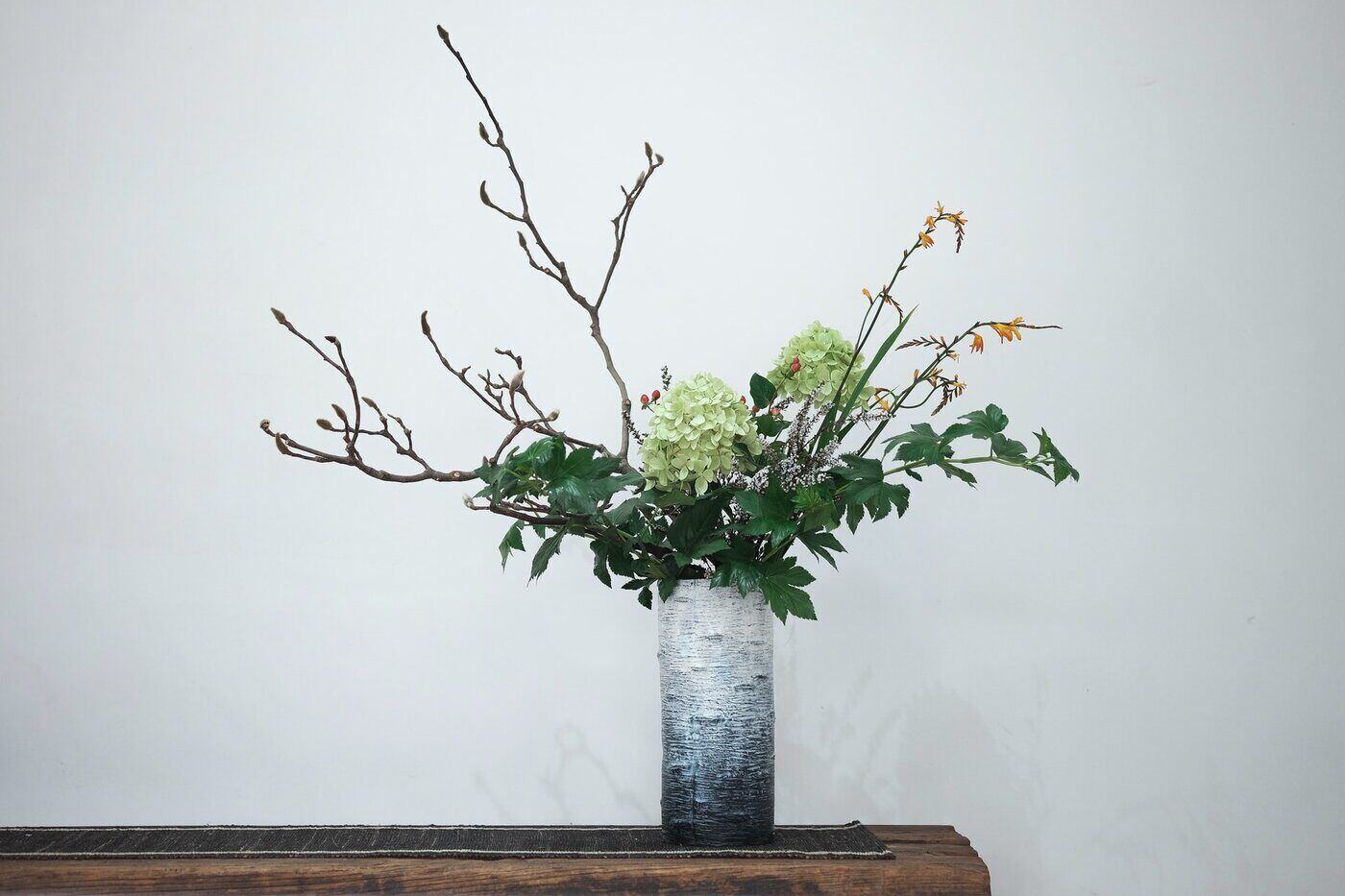 flowers and twigs in vase - principles of floral design